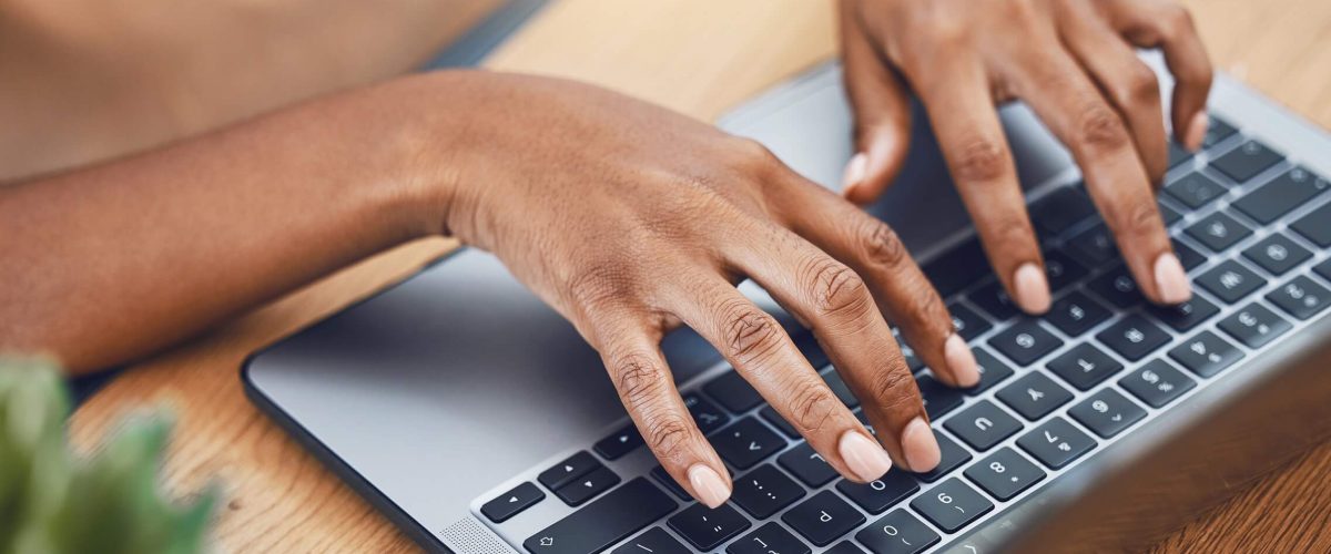 hands-laptop-and-black-woman-software-developer-o-2022-12-08-21-58-44-utc.jpg